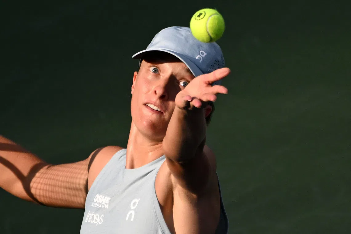 Aug 13, 2026; Toronto, Ontario, Canada; Iga Swiatek (POL) serves against Elena Rybakina (KAZ) during final round play at Sobeys Stadium. Mandatory Credit: Dan Hamilton-Imagn Images