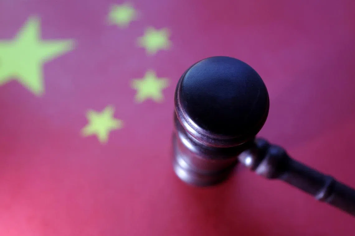 Chinese flag and Judge gavel are seen in this illustration taken, August 6, 2024. REUTERS/Dado Ruvic/Illustration