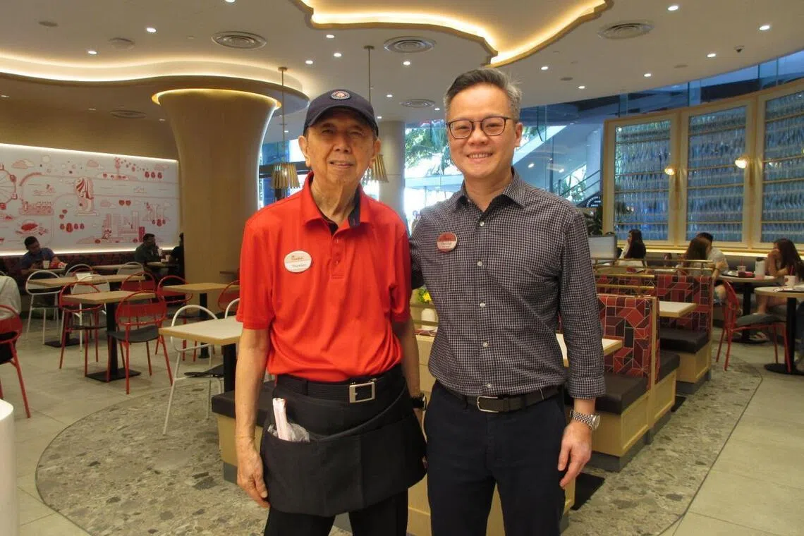Thomson Teo (left) works for his son-in-law Chyn Koh (right), the owner of Chick-fil-A Bugis+.