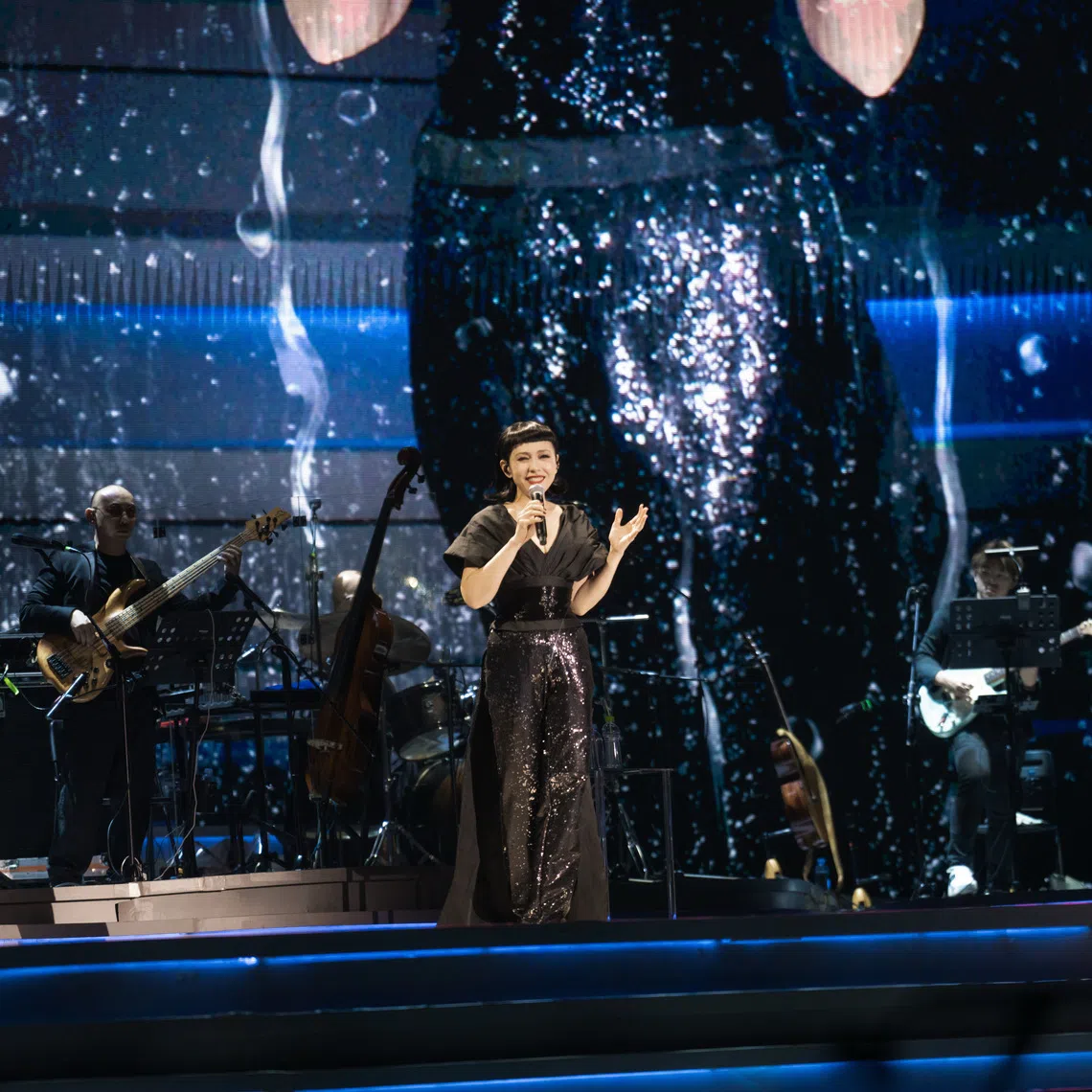 Singaporean singer Kit Chan performing Heartache (1994) at the Singapore Indoor Stadium on Sept 19.