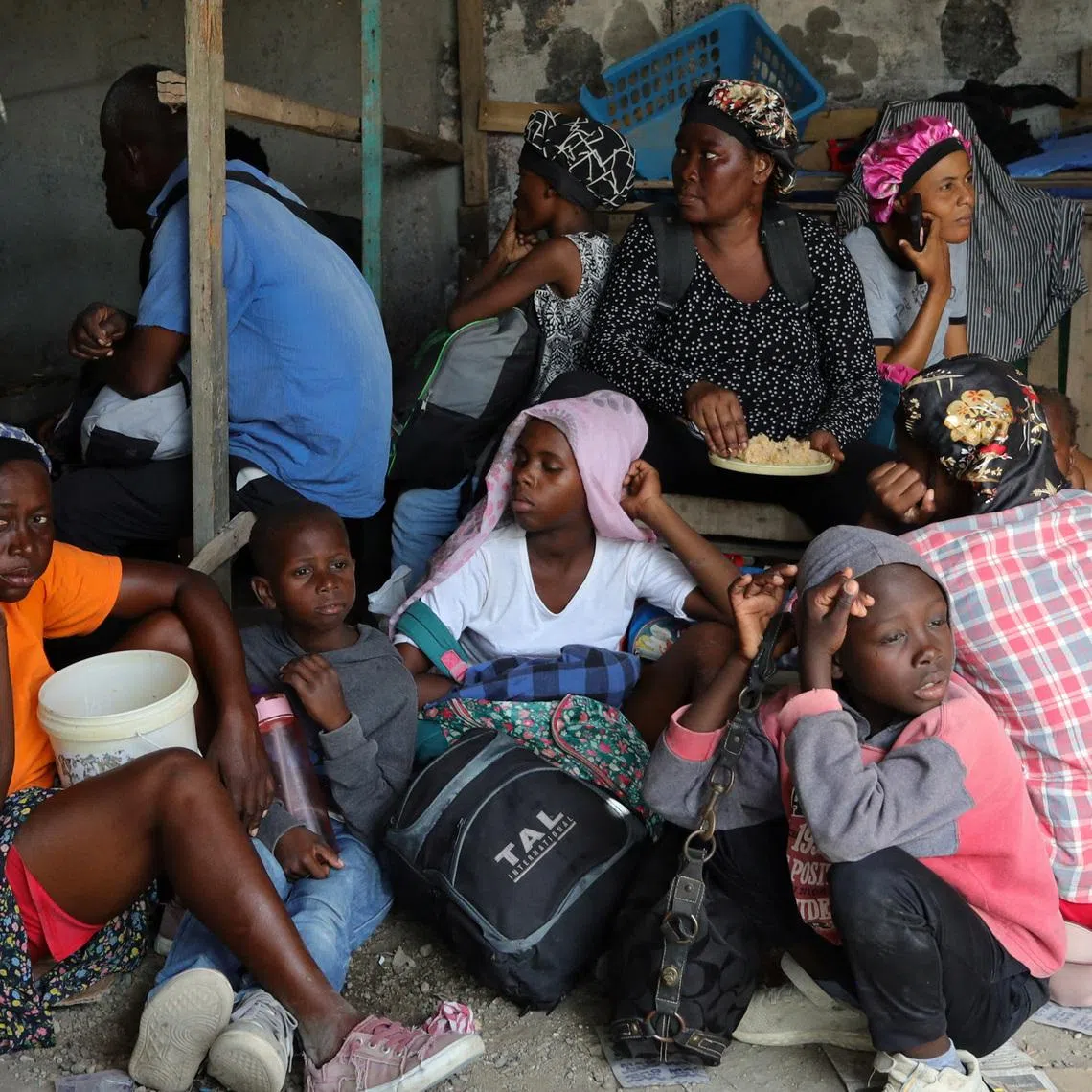 Residents rest while fleeing their homes near Cite Soleil after rival gang clashes worsened over the weekend in Haiti's capital, Port-au-Prince, Haiti, May 11, 2026. REUTERS/Fildor Pq Egeder