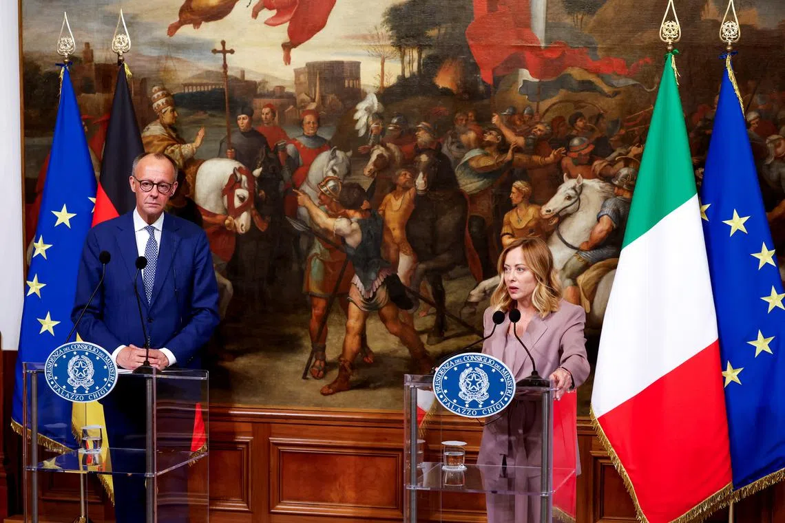 Italian Prime Minister Giorgia Meloni and German Chancellor Friedrich Merz attend a press conference, at Chigi Palace in Rome, Italy, May 17, 2025. REUTERS/Remo Casilli