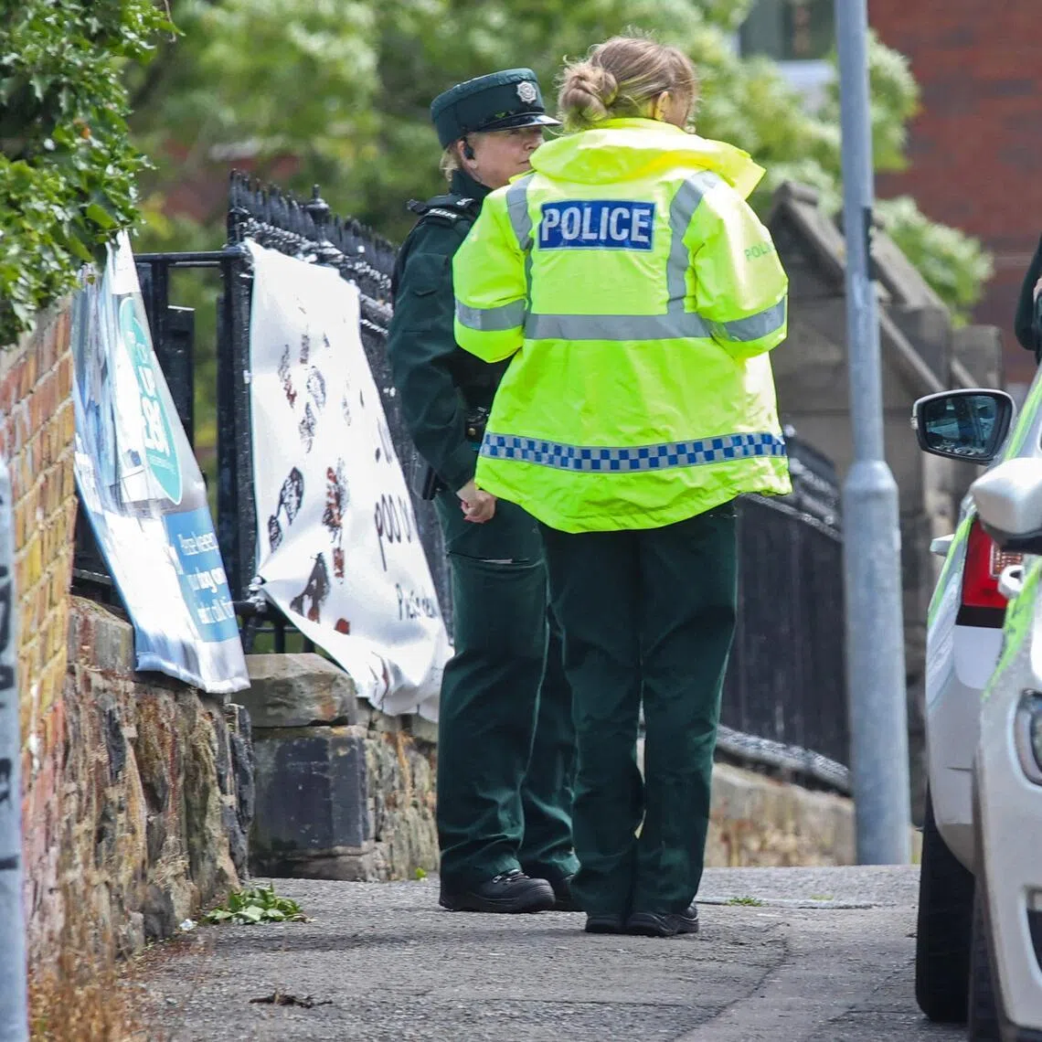 Police working at the scene of a stabbing on Kinnaird Avenue in north Belfast, Northern Ireland, on June 9.