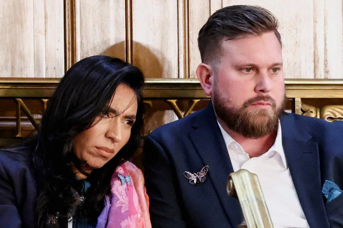Sky and Amanda Roberts, the brother and sister-in-law of the late Virginia Roberts Giuffre, a survivor of Jeffrey Epstein’s international trafficking ring, react as U.S. President Donald Trump delivers the State of the Union address in the House Chamber of the U.S. Capitol in Washington, D.C., U.S., February 24, 2026.  REUTERS/KEVIN LAMARQUE