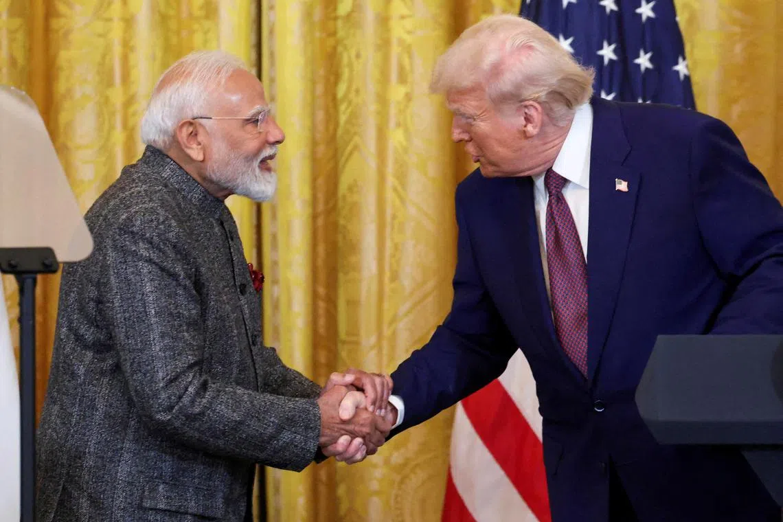 US President Donald Trump and Indian Prime Minister Narendra Modi shake hands as they attend a joint press conference at the White House on Feb 13.