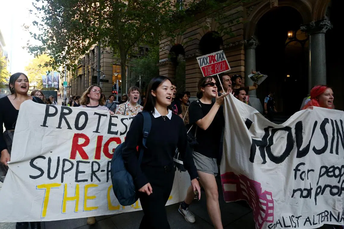 SYDNEY, AUSTRALIA - MARCH 24: Young tenants protest against rent increases at Martin Place on March 24, 2023 in Sydney, Australia. Australia is facing a rental crisis with vacancies at historic lows in multiple states, especially in the Eastern cities. Drastic increases in rent have forced many into difficult economic circumstances, as a confluence of factors have also driven inflation and interest rates up in rapid steps.  (Photo by Lisa Maree Williams/Getty Images)