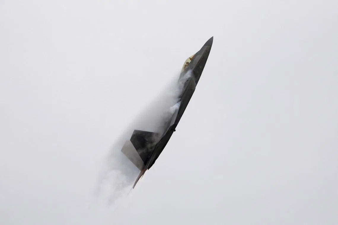FILE PHOTO: A U.S. Air Force F-22 Raptor fighter jet piloted by Major John Cummings performs maneuvers during the California International Airshow in Salinas, California, September 27, 2015. REUTERS/Michael Fiala/File Photo