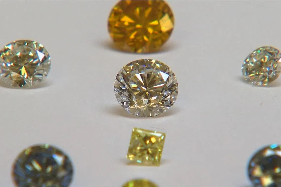 FILE PHOTO: A still image from video shows coloured synthetic diamonds on display at De Beers' International Institute of Diamond Grading and Research in Maidenhead August 15, 2016. REUTERS/Reuters/File Photo