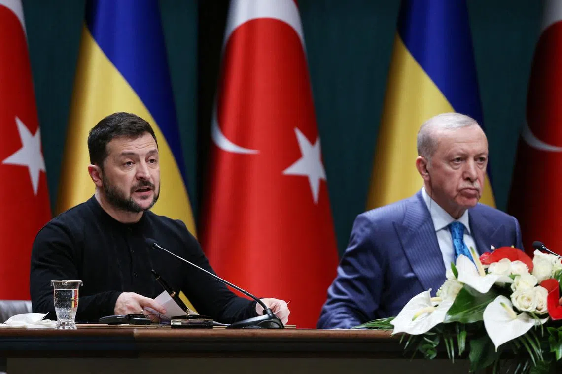 FILE PHOTO: Ukrainian President Volodymyr Zelenskiy speaks as Turkey’s President Tayyip Erdogan listens during a joint press conference in Ankara, Turkey, February 18, 2025. REUTERS/Cagla Gurdogan/File Photo