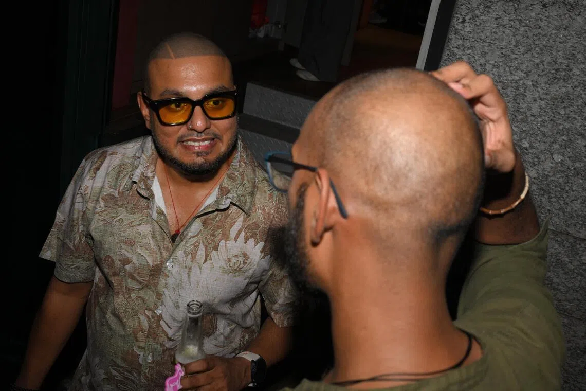 Organizer Aaghir Yadav chats with a participant during the Friday night event.