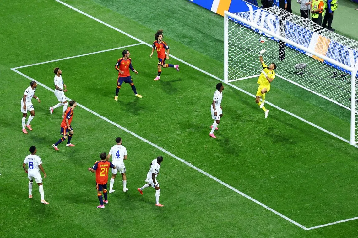 Cape Verde's Vozinha makes a save from Spain's Mikel Oyarzabal during both teams' 0-0 draw on June 15.