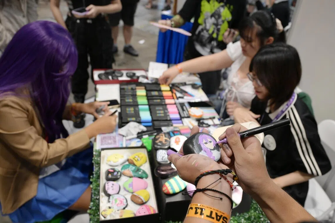Students from Temasek Polytechnic’s Visual Arts and Writing Club at the Creators Super Fest Singapore 2026 at Suntec Singapore Convention & Exhibition Centre on July 11.