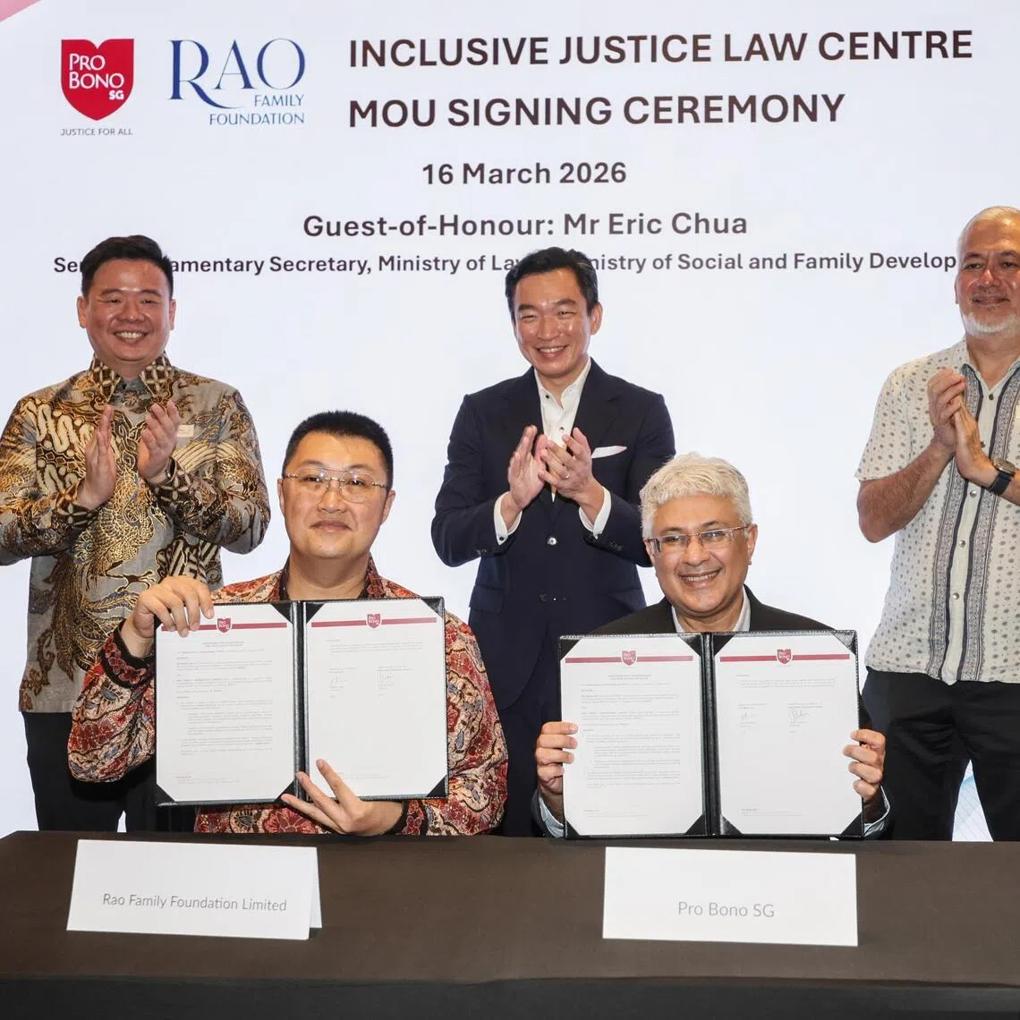 Slug: ssjustice16
ST Photo: Gin Tay

Signing of Memorandum of Understanding (MOU) by Pro Bono SG and Rao Family Foundation during the launch of Singapore's First Inclusive Justice Law Centre for Individuals with Invisible Disabilities at The Foundry on Mar 16, 2026. 

(From left): Mr Jimmy Budiarto Rao (Chairman of Rao Family Foundation) and Mr Dinesh Dhillon (Chairman of Pro Bono SG) signing the MOU, witnessed by (back row from left): Mr James Zou (Director of Rao Family Foundation); Mr Eric Chua (Senior Parliamentary Secretary, Ministry of Law and Ministry of Social and Family Development); and Mr Tanguy Lim (CEO of Pro Bono SG); during the launch of Singapore's First Inclusive Justice Law Centre for Individuals with Invisible Disabilities at The Foundry on Mar 16, 2026.