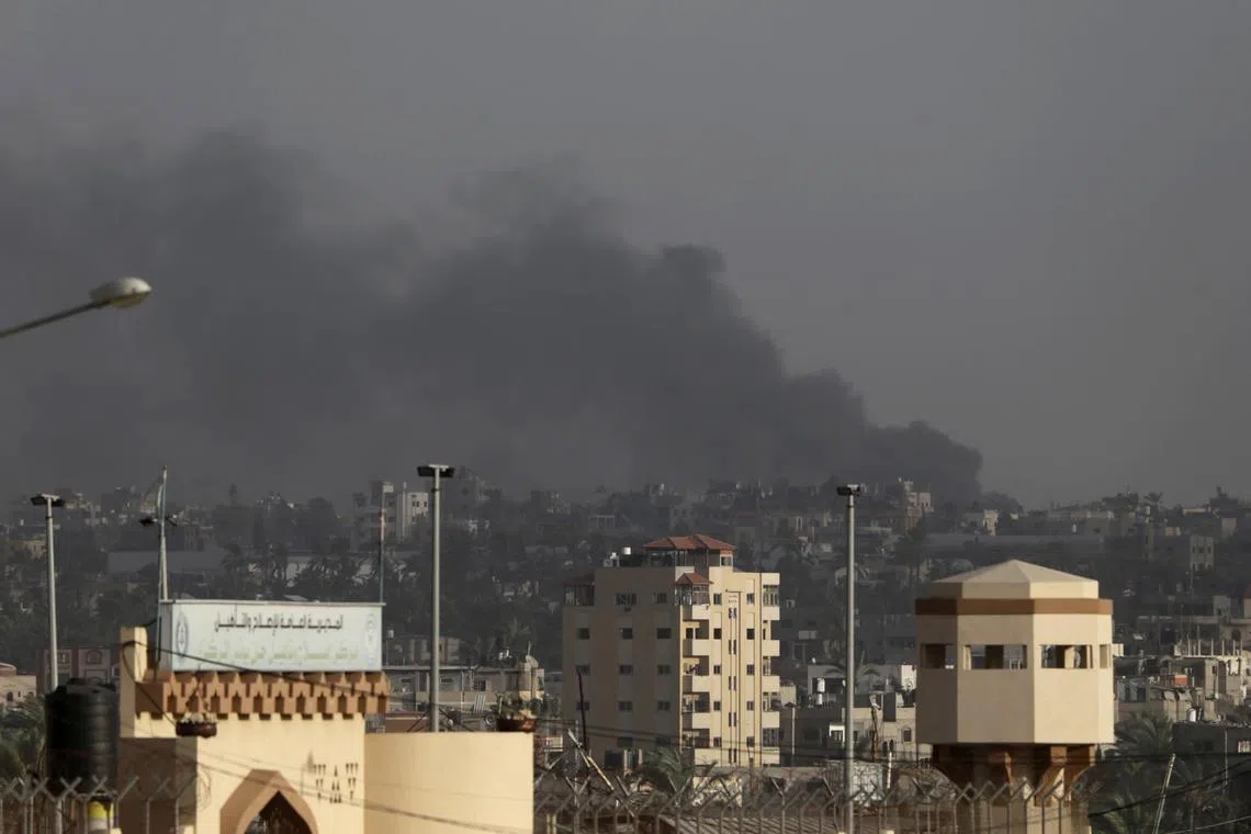 Smoke rises following Israeli air strikes in Khan Younis, in the southern Gaza Strip.