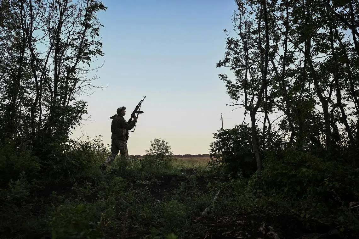 A Ukrainian soldier looks out to the sky for any drone incursions. Ukraine and Russia launched a flurry of drones at one another on Aug 17, ahead of a meeting between Ukrainian President Volodymyr Zelensky and US President Donald Trump.
