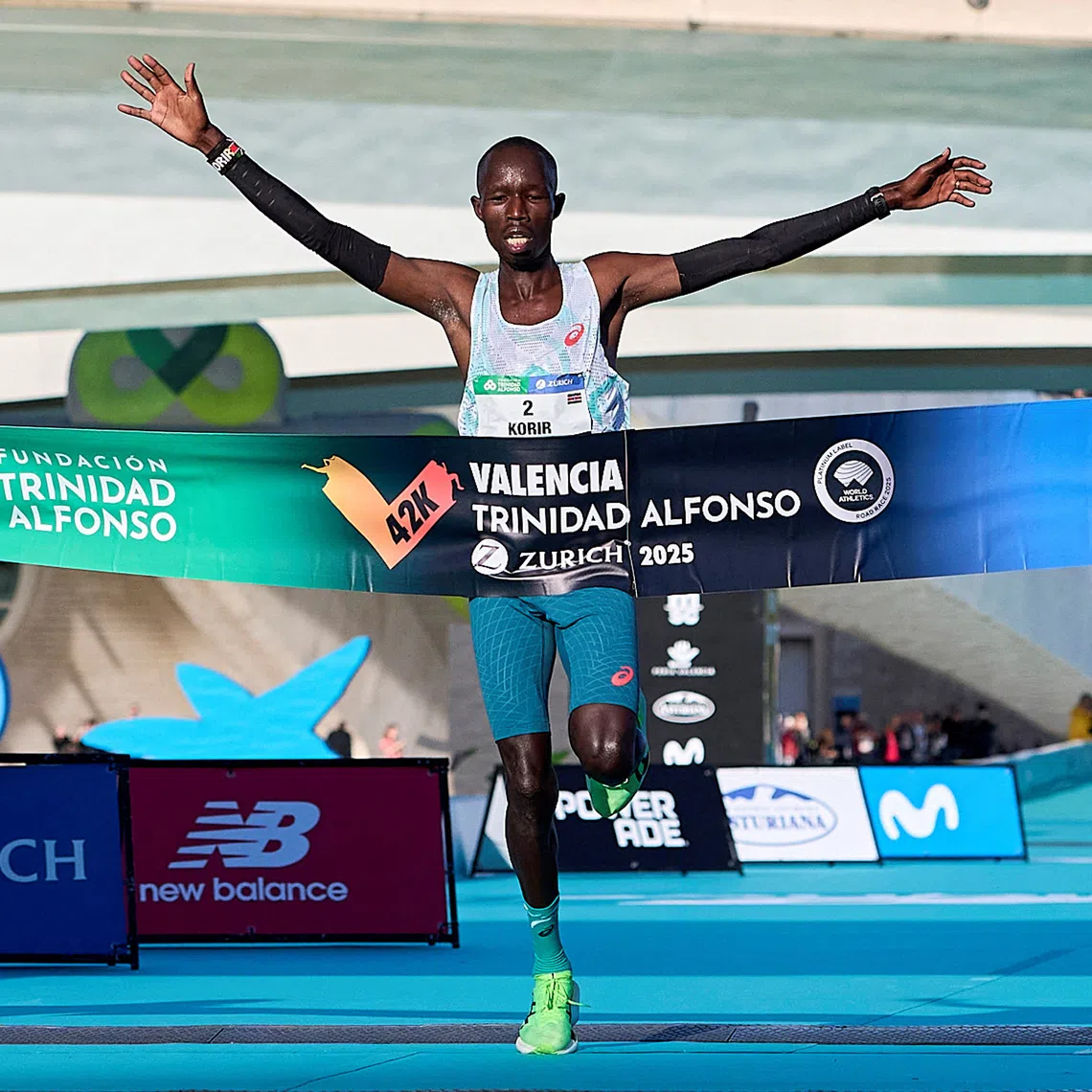 Athletics - Valencia Marathon - Valencia, Spain - December 7, 2025 Kenya's John Korir reacts as he crosses the line to win the Valencia marathon REUTERS/Pablo Morano