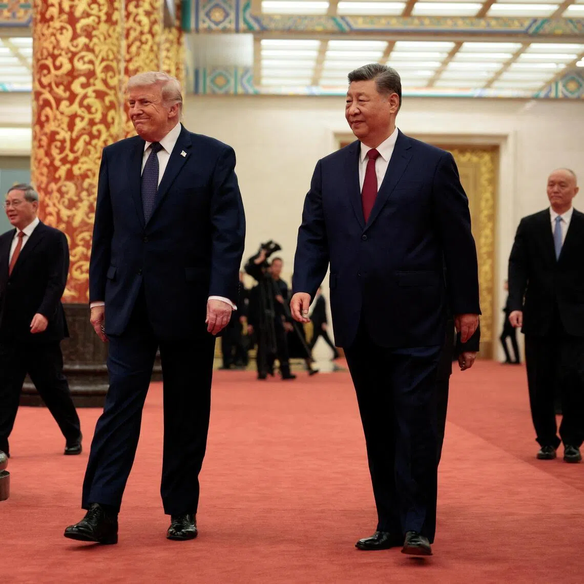 US President Donald Trump (left) and Chinese President Xi Jinping arriving for a state banquet at the Great Hall of the People in Beijing, China, on May 14.