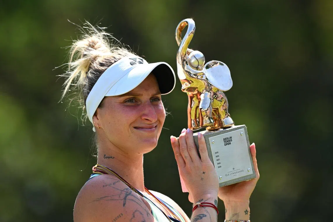 Tennis - Berlin Tennis Open - Steffi Graf Stadium, Berlin, Germany - June 22, 2025 Czech Republic's Marketa Vondrousova celebrates with a trophy after winning her final match against China's Xinyu Wang REUTERS/Annegret Hilse