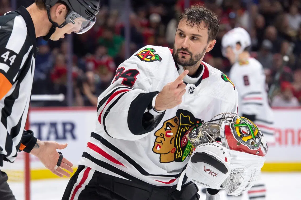 Mar 28, 2024; Ottawa, Ontario, CAN; Chicago Blackhawks goalie Petr Mrazek (34) skates to the bench to replace his helmet following a save in the first period against the Ottawa Senators at the Canadian Tire Centre. Mandatory Credit: Marc DesRosiers-USA TODAY Sports/File Photo