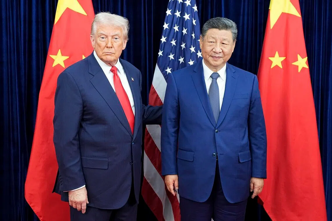 US President Donald Trump (left) meets with Chinese President Xi Jinping in Busan, South Korea, Oct 30, 2025. 