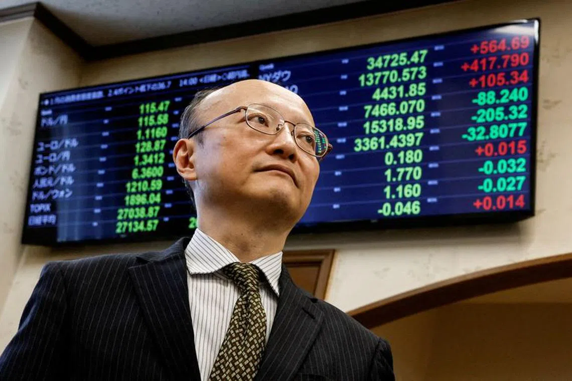 FILE PHOTO: Japan's vice minister of finance for international affairs, Masato Kanda, poses for a photograph during an interview with Reuters at the Finance Ministry in Tokyo, Japan January 31, 2022. REUTERS/Issei Kato/File Photo