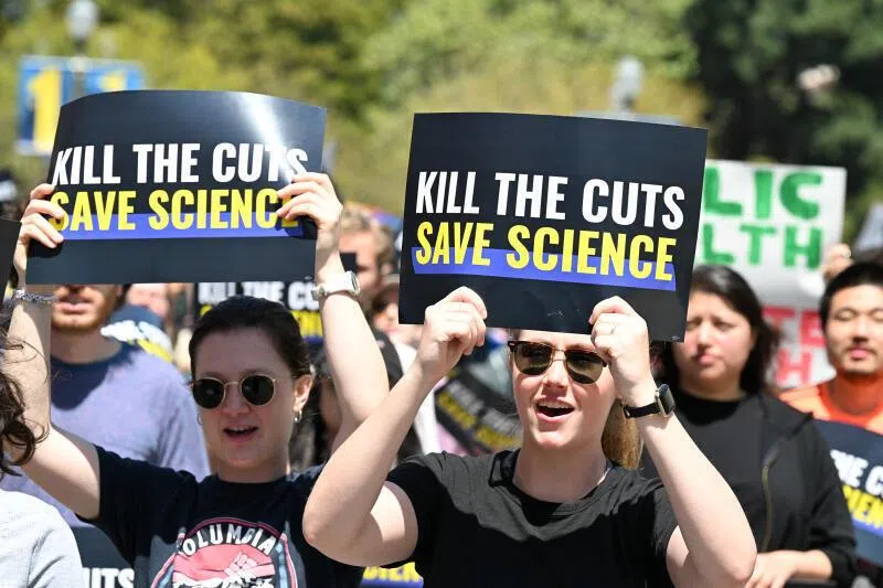 Demonstrators rally during a “Kill the Cuts” protest against the Trump administration’s funding cuts in April 2025.