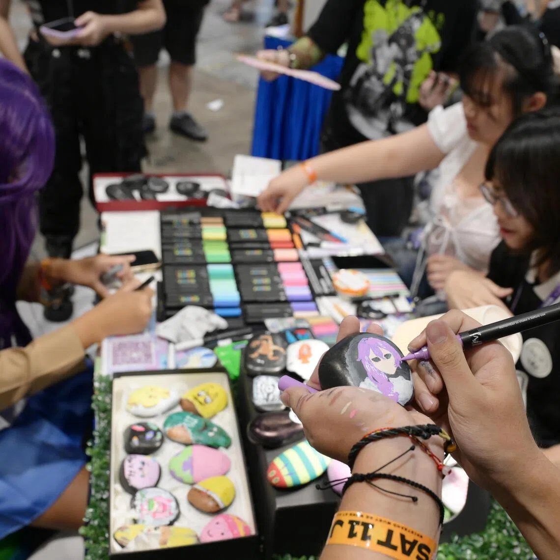 Students from Temasek Polytechnic’s Visual Arts and Writing Club at the Creators Super Fest Singapore 2026 at Suntec Singapore Convention & Exhibition Centre on July 11.