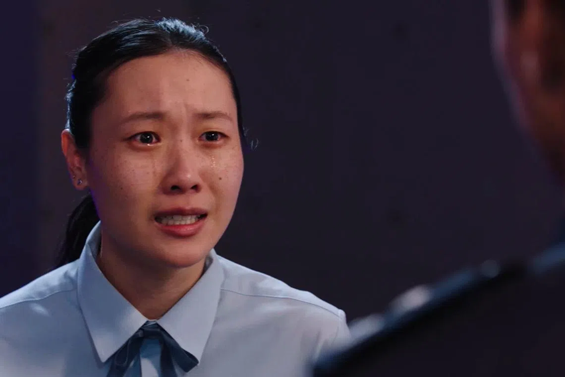 Lim Shi-An in a still from Third Rail, in which she plays a student whose father has been taken hostage in a train hijacking.

