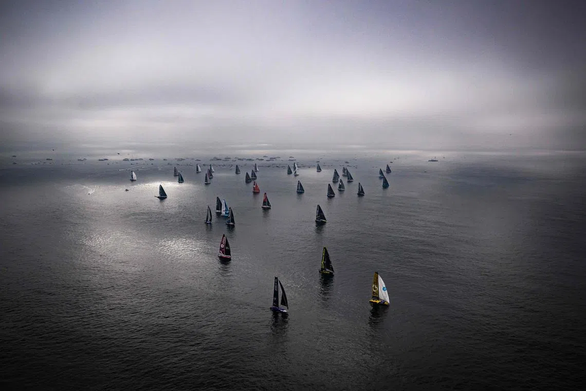 Skippers sailingtheir Imoca 60 monohulls at the start the 10th edition of the Vendee Globe around the world monohull solo sailing race, off Les Sables-d'Olonne on November 10, 2024. 