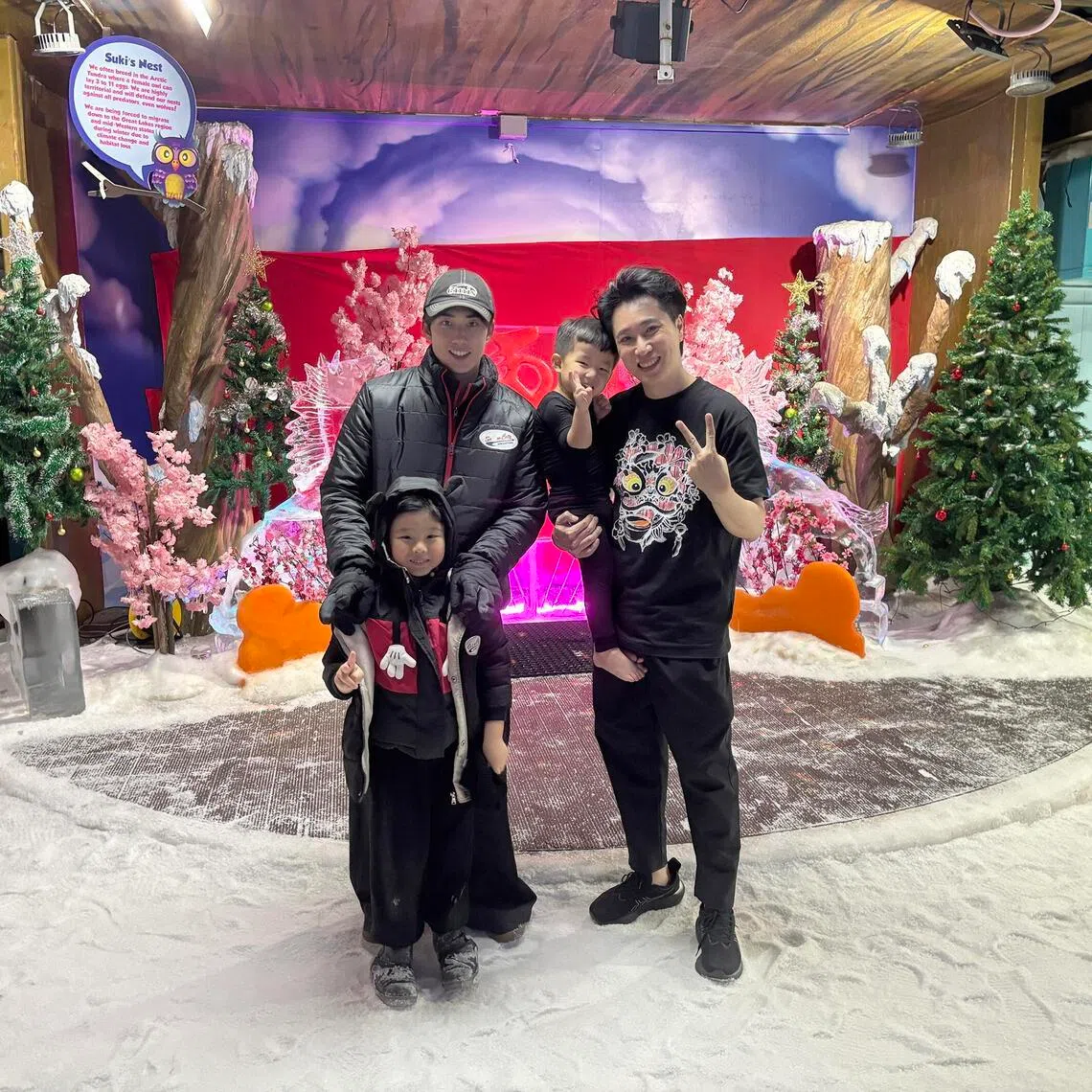 Singapore actors Yang Yan (left) and Dasmond Koh with Mr Koh's grandnephews at Snow City on May 20.