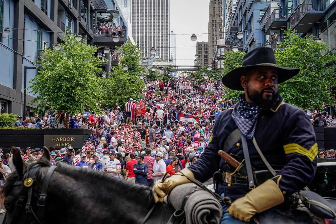Soccer Football - FIFA World Cup 2026 - Group D - United States v Australia - Fans in Seattle - Seattle, Washington, U.S. - June 19, 2026 A member of the Buffalo Soldiers of Seattle rides a horse as United States fans gather at a screening in Seattle ahead of the match. REUTERS/David Ryder