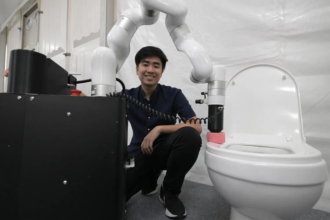 octoilet01/ST20231101_202390035789/Ng Sor Luan/Co-founder and COO of Hivebotics Nguyen Tuan Dung with the company's toilet cleaning robot which is being tested by JTC in industrial parks. 
//
Showcase of new tech innovations by start ups as part of the Singapore Week for Innovation and Technology. Among the innovations showcased is a toilet cleaning robot which is being tested by JTC in industrial parks.