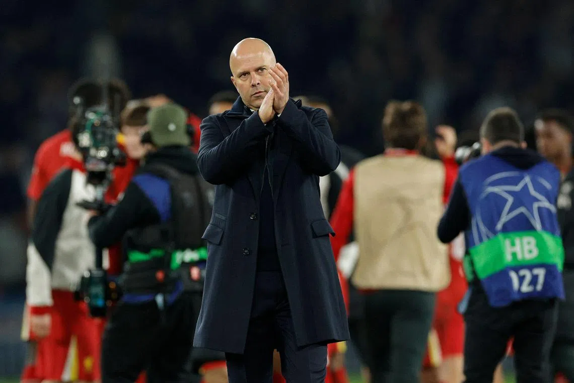 Liverpool manager Arne Slot acknowledges fans after the 1-0 Champions League win over Paris Saint-Germain.