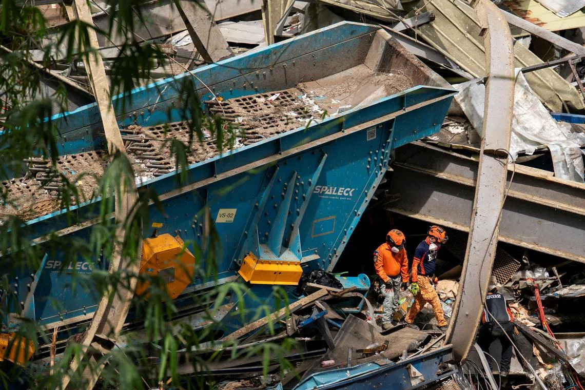 Workers conduct a rescue operation at the collapsed landfill in Binaliw, Cebu, Philippines, on Jan 10.