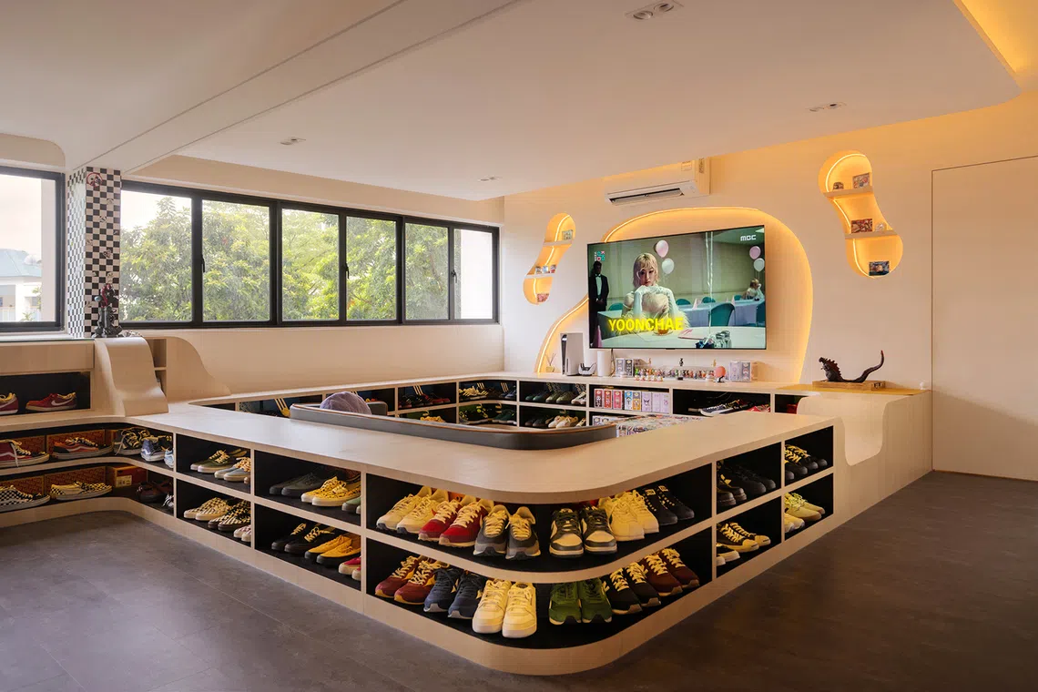 The centrepiece of this HDB flat is a conversation pit with eclectic seating that reflects the family’s playful, informal personality and love of sneakers. 