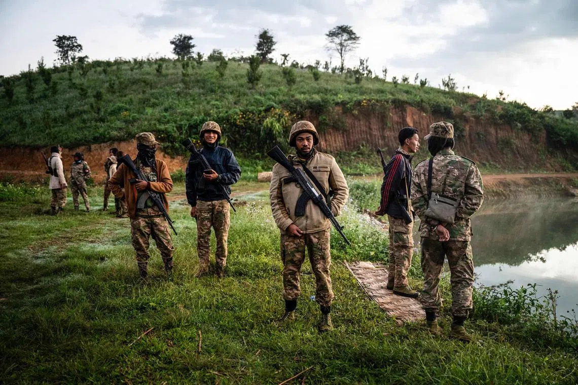 Members of the Mandalay People’s Defence Forces man a checkpoint near the frontline in Myanmar's ongoing civil war. 
