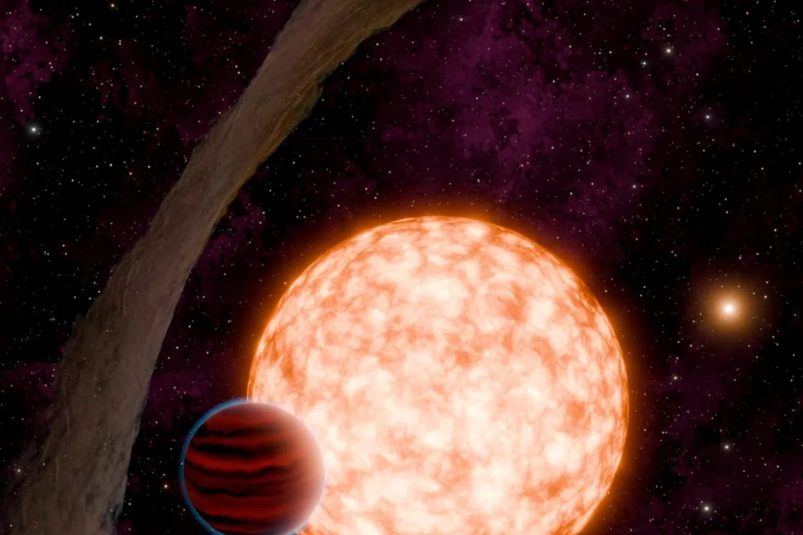 An artist's depiction of a planet and its host star with a misaligned disk of material, and a binary companion in the background, is shown in this undated handout image. NASA/JPL-Caltech/R. Hurt, K. Miller (Caltech/IPAC)/Handout via REUTERS