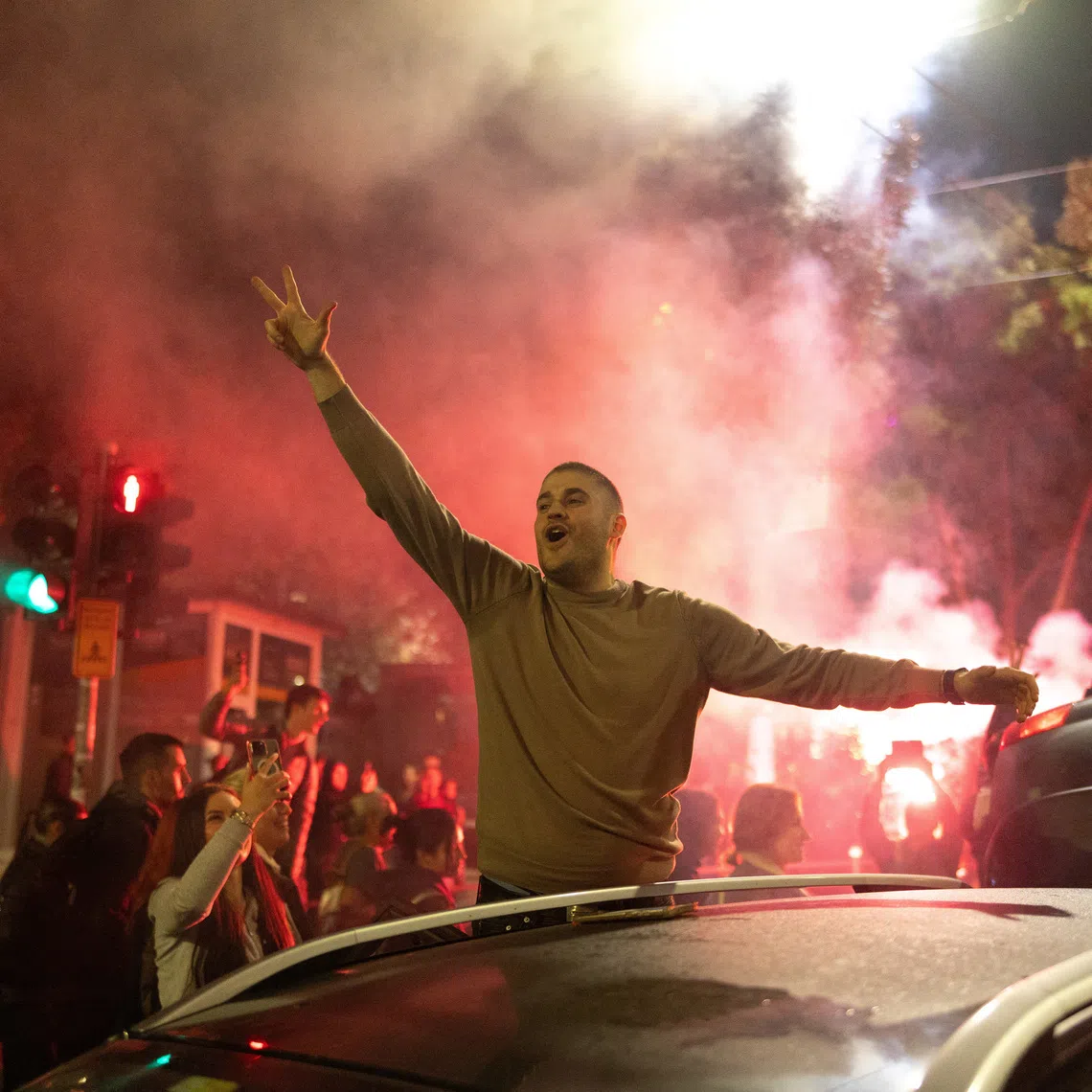 Supporters of the electoral list \"Student List - Students Win\" celebrate after Aleksandar Vucic, Serbian Progressive Party (SNS) prime ministerial candidate, conceded defeat in the parliamentary election in Belgrade, Serbia, October 26, 2026. REUTERS/Uros Arsic