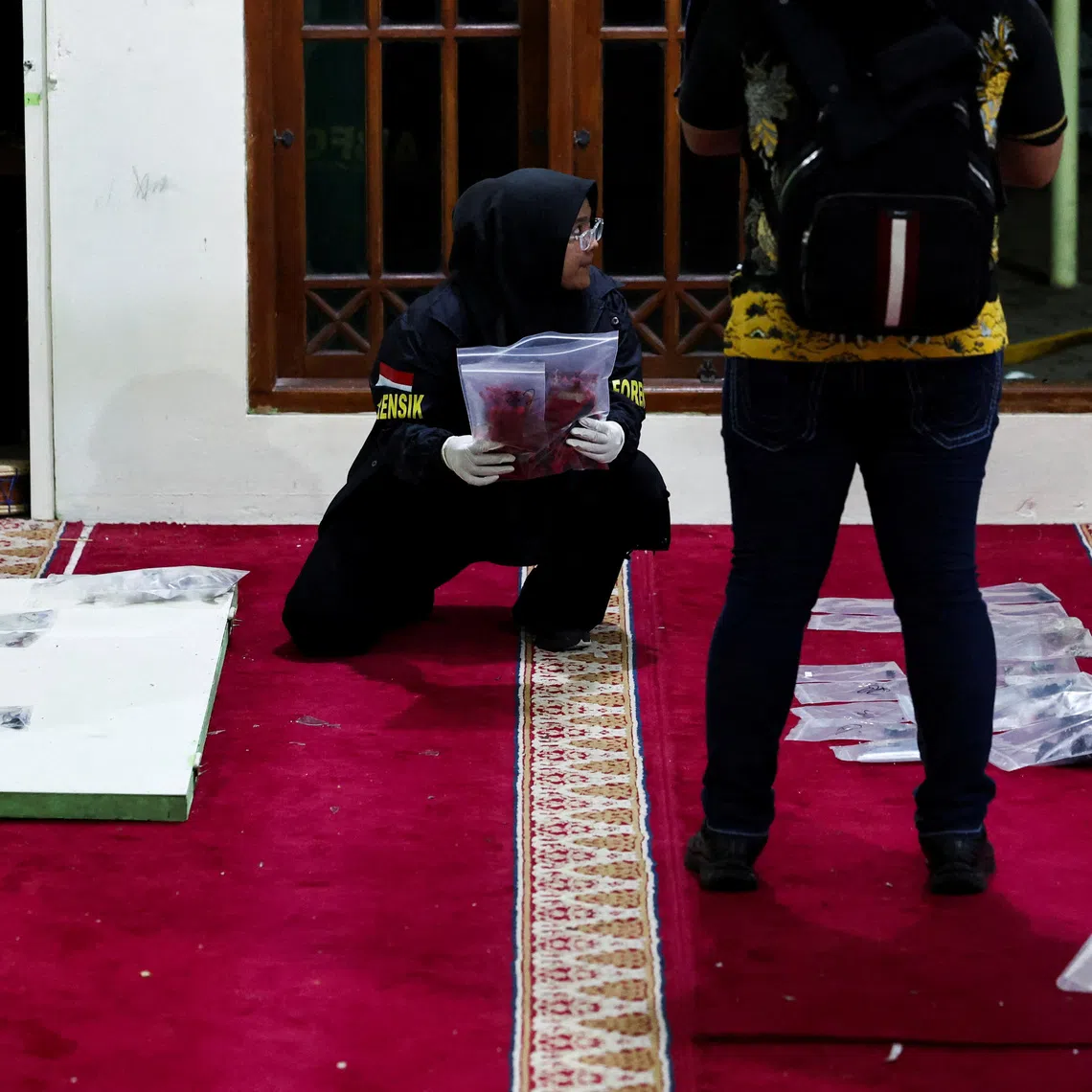 Forensic police officers collecting evidence after an explosion occurred at a mosque inside a school complex in Jakarta on Nov 7.