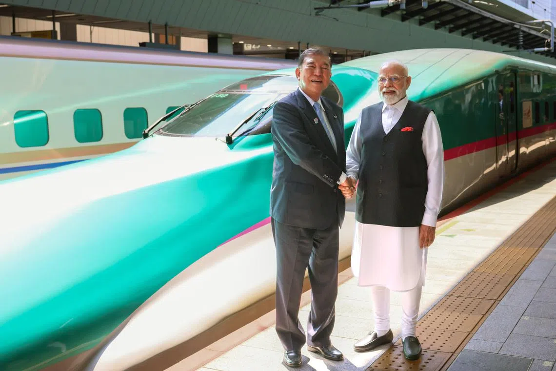 Japanese Prime Minister Shigeru Ishiba (left) and Indian Prime Minister Narendra Modi shaking hands on Aug 30.