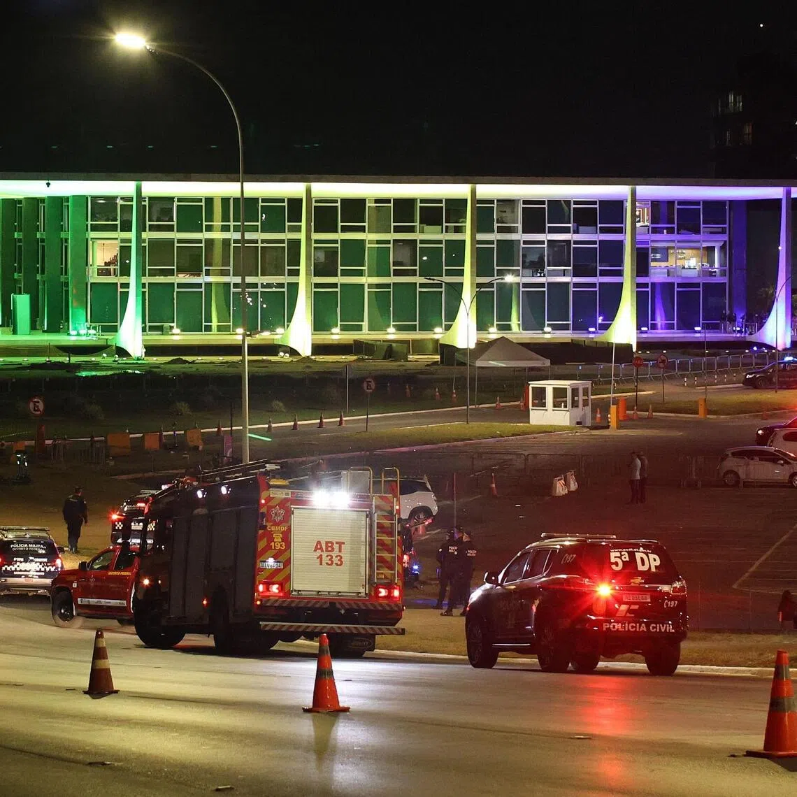 Brazilian police and firefighters inspect the area of a possible bomb in a backpack outside the Supreme Court headquarters in Brasilia on Oct 1.