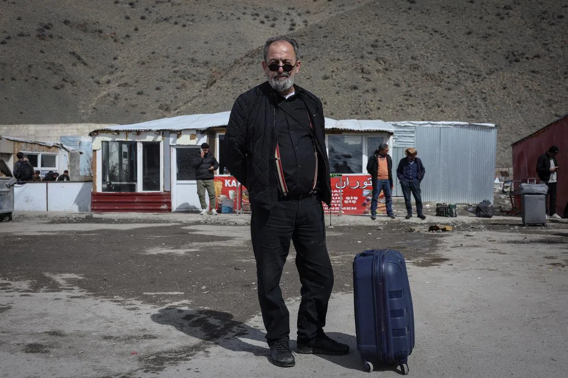 Mr Ebrahim Eidi, 61, who arrived in Turkey from Iran, poses for a portrait after crossing into Turkey, in Van province, Turkey, on March 6.