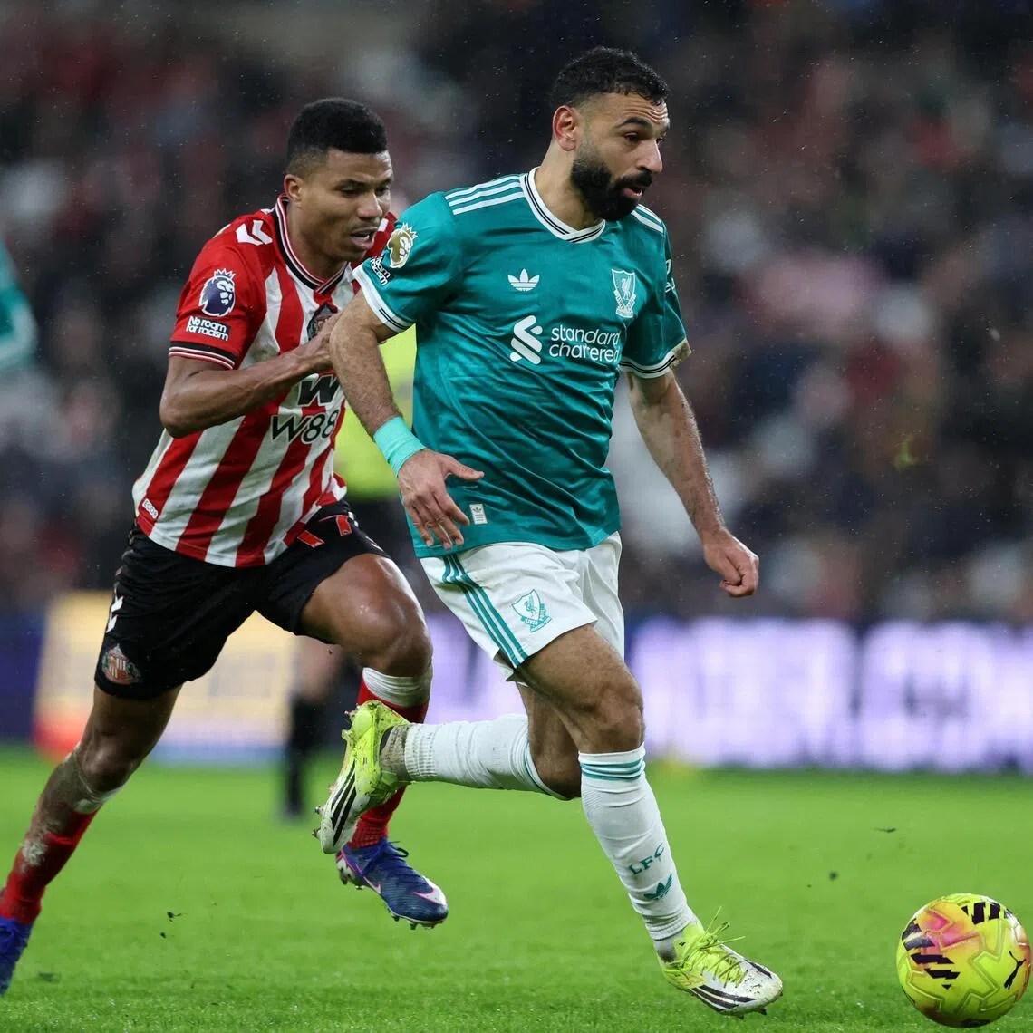 Liverpool's Mohamed Salah in action with Sunderland's Reinildo Mandava during the Reds' 1-0 win on Feb 11.