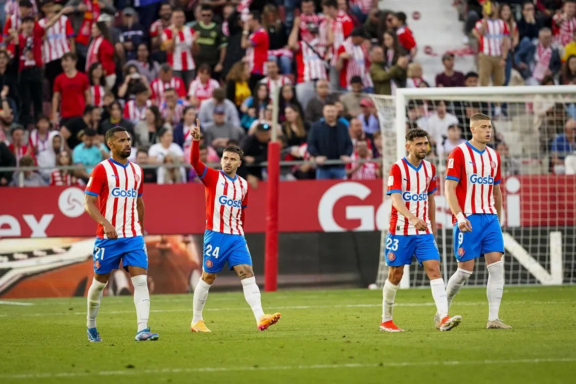 Girona's fightback against Barcelona left Carlo Ancelotti's Real Madrid with an unassailable lead in the standings.