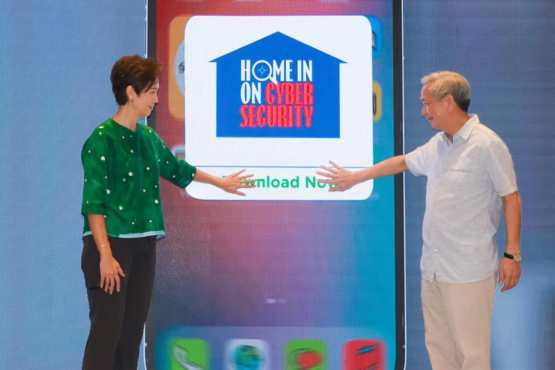 ST20230930_202304500821: Gin Tay/ occsa30/ Osmond Chia/

Mrs Josephine Teo, (left) Minister for Communications and Information and Minister-in-charge of Smart Nation and Cybersecurity; and Mr David Koh, Chief Executive, CSA ; at the launch of Home in on Cyber Security roadshow at Suntec City Convention Centre Atrium on Sep 30, 2023.