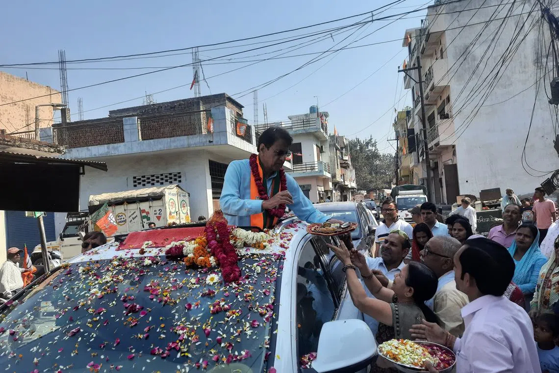 Mr Arun Govil, the BJP candidate for Meerut parliamentary seat, being greeted by his supporters at a campaign rally in the city in Uttar Pradesh.