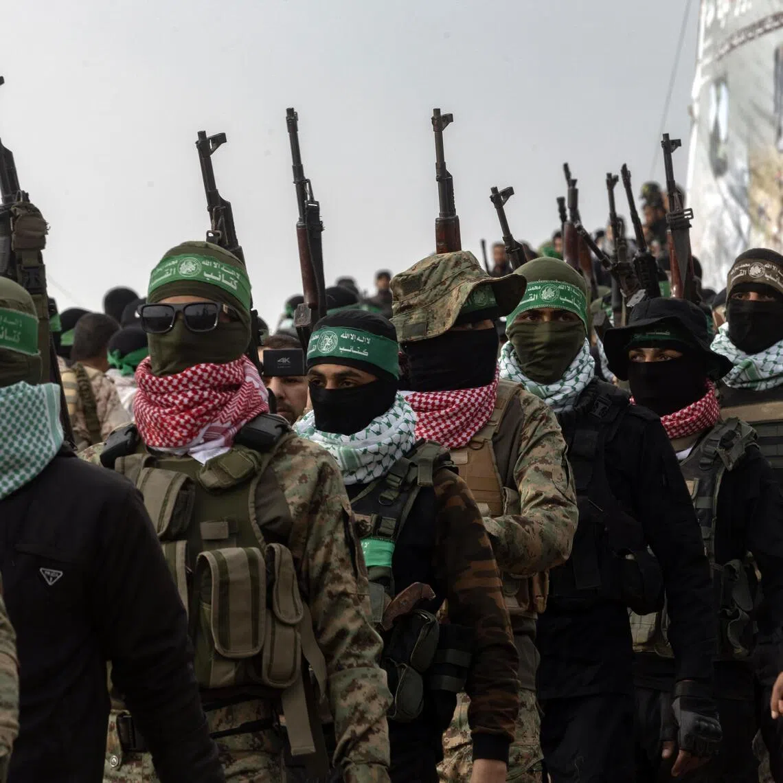 Armed members of Hamas in Khan Younis, in southern Gaza, on Feb 20, 2025. US President Donald Trump's Board of Peace is demanding that Hamas finalize an agreement to demilitarize Gaza.