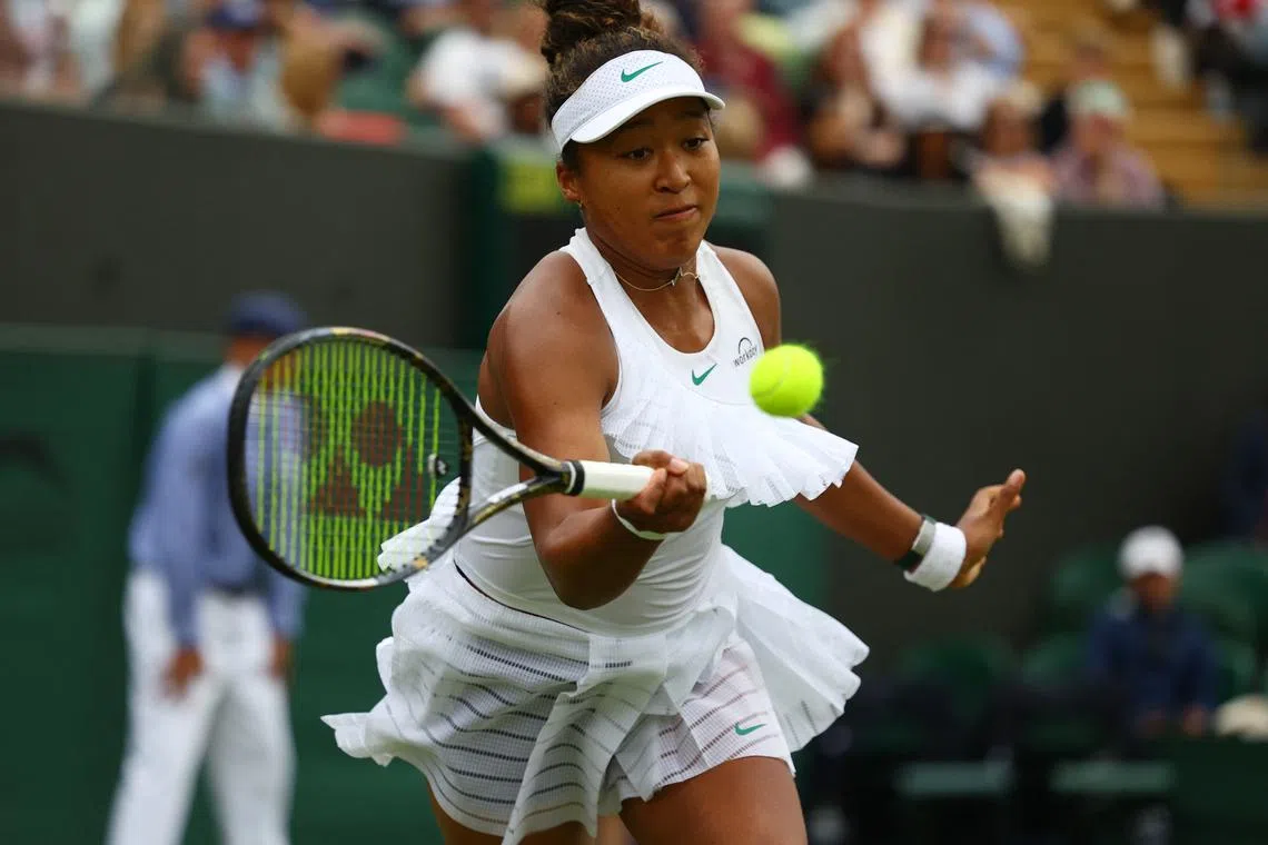Tennis - Wimbledon - All England Lawn Tennis and Croquet Club, London, Britain - July 1, 2024 Japan's Naomi Osaka in action during her women's singles first round match against France's Diane Parry REUTERS/Paul Childs