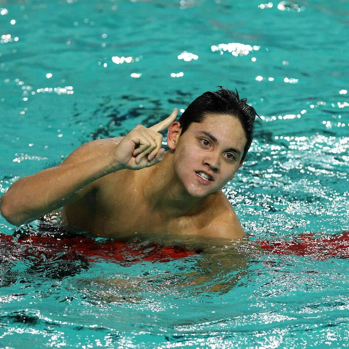 National swimmer Joseph Schooling celebrating his win in the men's 200m butterfly at the 2011 SEA Games.