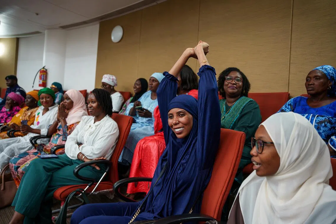Gambian activist Jaha Dukureh celebrates after the country's parliament rejected the bill to end a ban on female genital mutilation (FGM) in Banjul, Gambia July 15, 2024. REUTERS/Malick Njie